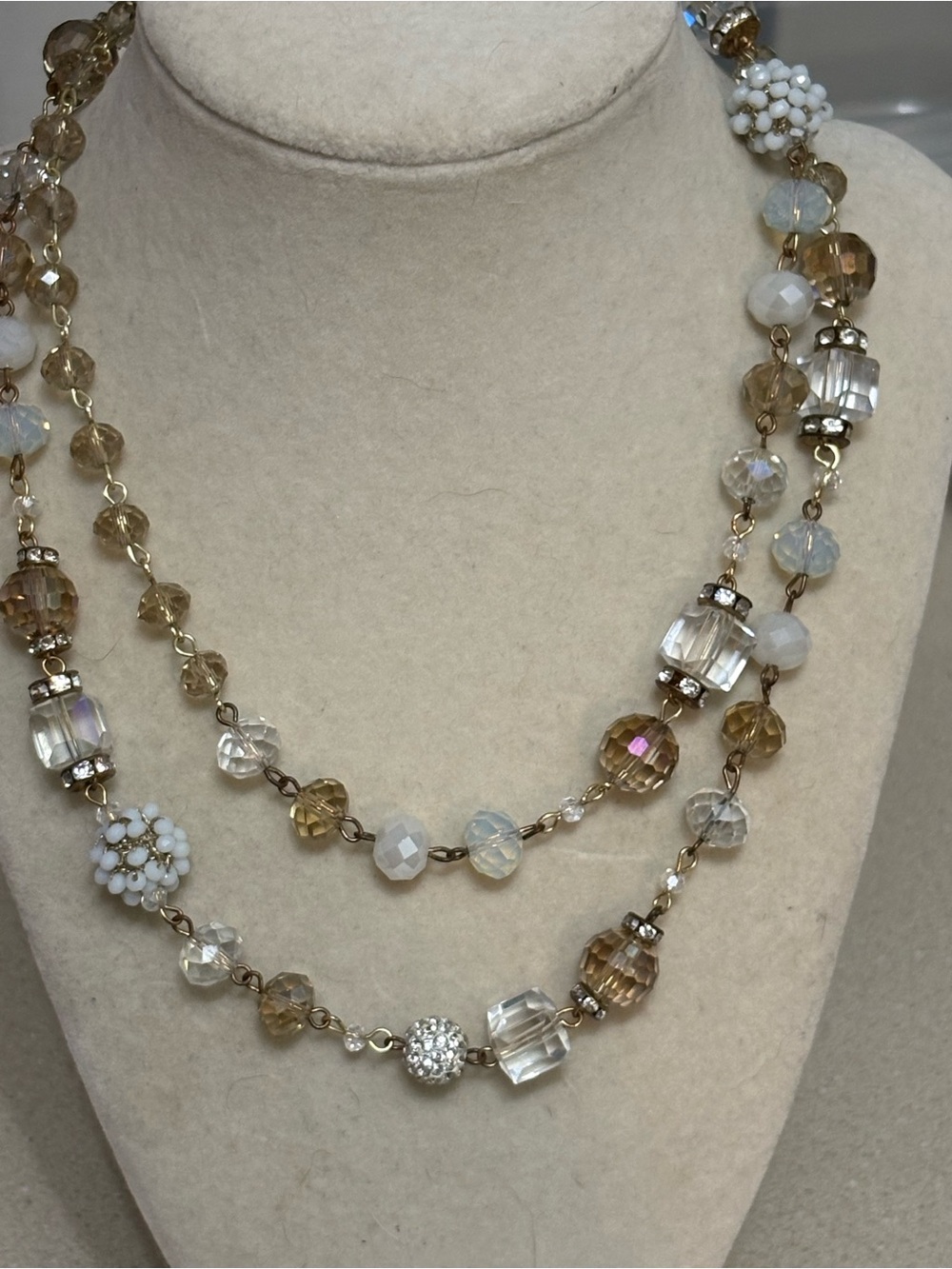 Long strand crystal beaded necklace by Rush Denis & Charles Champagne glass